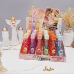 لیپ گلاس شاین دار طرح بطری شامپاین برند هدا بر HUDA BEAR کد M031