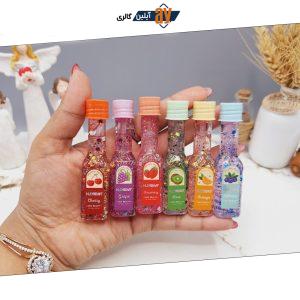 لیپ گلاس گلیتری طرح بطری شامپاین برند هدا بر HUDA BEAR کد M030