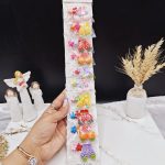 پک 10 عددی گیره مو دخترانه طرح گل و میوه
