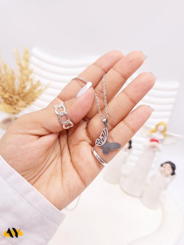ست گوشواره و گردنبند طرح پروانه مخرج کاری نقره ای استیل