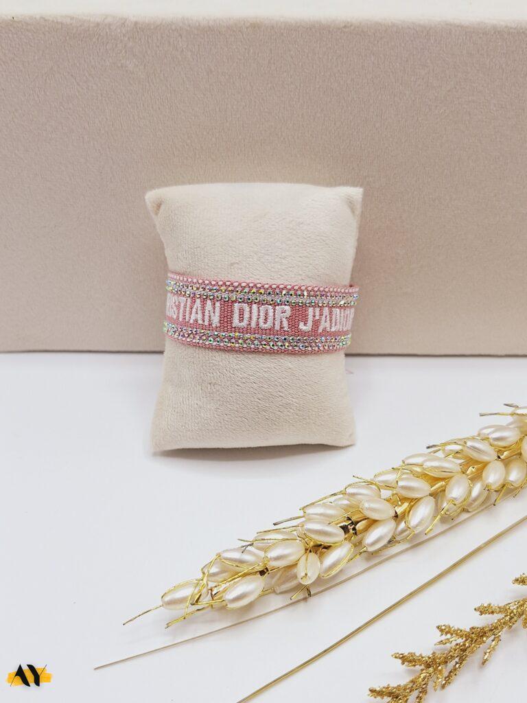 دستبند پارچه ای نگین دار CHRISTIAN DIOR (رنگ گلبهی)